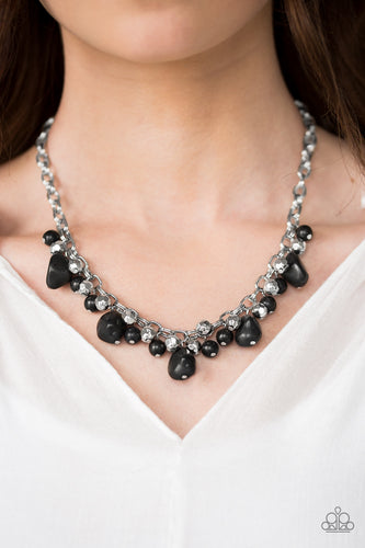 Featuring round and asymmetrical cuts, refreshing black stones trickle from the bottom of a double chain-linked chain. Faceted silver beads trickle between the stones, adding a splash of metallic shimmer to the earthy fringe. Features an adjustable clasp closure.  Sold as one individual necklace. Includes one pair of matching earrings.  Always nickel and lead free.
