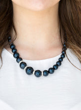 Load image into Gallery viewer, Gradually increasing in size, luminescent blue pearls trickle below the collar for a classic look. Encrusted in dazzling white rhinestones, glittery rings are sprinkled between the pearls for a timeless finish. Features an adjustable clasp closure.  Sold as one individual necklace. Includes one pair of matching earrings.   