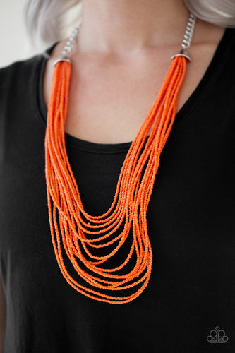 Infused with two bold silver fittings, row after row of orange seed beads layer across the chest for a seasonal fashion. Features an adjustable clasp closure.  Sold as one individual necklace. Includes one pair of matching earrings.  Always nickel and lead free. 