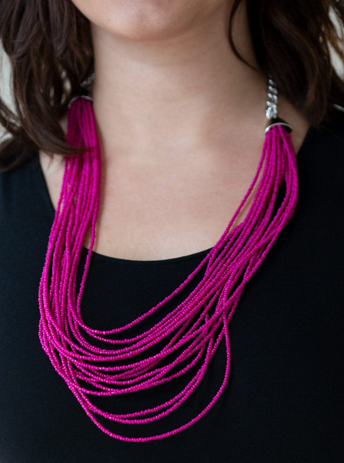 Infused with two bold silver fittings, row after row of pink seed beads layer across the chest for a seasonal fashion. Features an adjustable clasp closure.  Sold as one individual necklace. Includes one pair of matching earrings. 