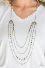 Load image into Gallery viewer, Attached to two ornate floral silver fittings, shimmery silver chains and strands of polished green and glassy crystal-like beads cascade across the chest for a whimsically layered look. Features an adjustable clasp closure.  Sold as one individual necklace. Includes one pair of matching earrings.  Always nickel and lead free.