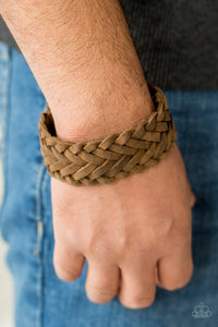 Distressed leather bands weave across the wrist for a rugged look. Features an adjustable snap closure.  Sold as one individual bracelet.  Always nickel and lead free. 