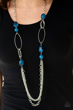 Load image into Gallery viewer, Featuring polished and cloudy faux rock finishes, blue beads link with bold silver hoops. The whimsical compilation gives way to layers of mismatched silver chains for a seasonal finish. Features an adjustable clasp closure.  Sold as one individual necklace. Includes one pair of matching earrings.   Always nickel and lead free.