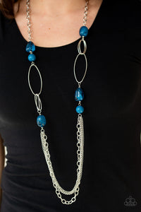 Featuring polished and cloudy faux rock finishes, blue beads link with bold silver hoops. The whimsical compilation gives way to layers of mismatched silver chains for a seasonal finish. Features an adjustable clasp closure.  Sold as one individual necklace. Includes one pair of matching earrings.   Always nickel and lead free.