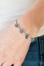 Load image into Gallery viewer, Featuring lifelike detail, a row of shimmery silver flowers links around the wrist for a seasonal look. Features an adjustable clasp closure.  Sold as one individual bracelet.  Always nickel and lead free.