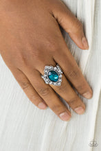 Load image into Gallery viewer, A glassy blue gem is pressed into a marquise-shaped silver frame radiating with glittery white rhinestones for a regal look. Features a stretchy band for a flexible fit.  Sold as one individual ring.  Always nickel and lead free.