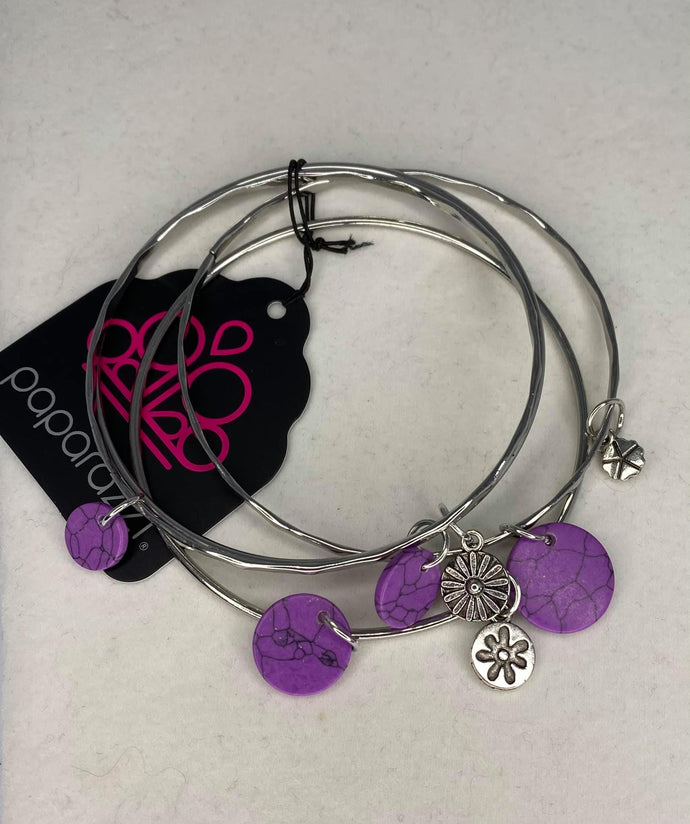 Infused with mismatched silver floral charms and vivaciously speckled purple stone discs, a stack of hammered silver bangles slides along the wrist for a colorful earthy look.  Sold as one set of four bracelets.  Always nickel and lead free.  Fashion Fix Exclusive December 2020