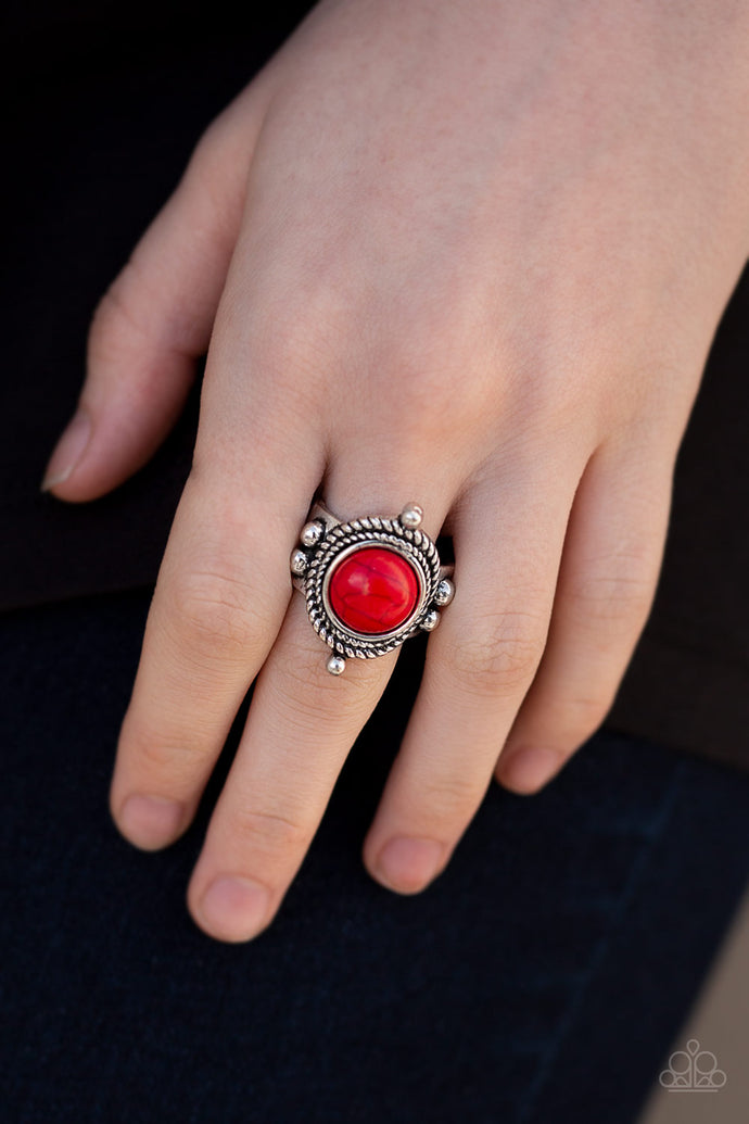 A smooth red stone is pressed into the center of a silver frame radiating with studded and twisted rope-like textures for an artisan inspired look. Features a stretchy band for a flexible fit.  Sold as one individual ring.  Always nickel and lead free.