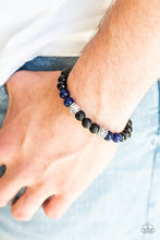 Load image into Gallery viewer, Essential Oil Alert!! Infused with ornate silver accents, an earthy collection of glassy black beads, blue stone beads, and black lava rock beads are threaded along a stretchy band around the wrist for a seasonal look.  Sold as one individual bracelet.  Always nickel and lead free.