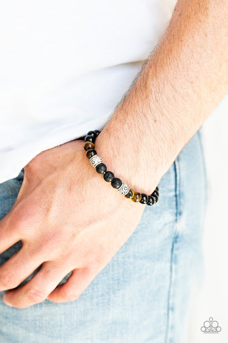 Essential Oil Alert!!  Infused with ornate silver accents, an earthy collection of glassy black beads, tiger's eye stone beads, and black lava rock beads are threaded along a stretchy band around the wrist for a seasonal look.  Sold as one individual bracelet. Always nickel and lead free.