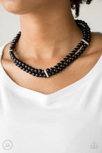 Load image into Gallery viewer, Pinched between white rhinestone encrusted frames, strands of classic black beads layer around the neck for a timeless look. Features an adjustable clasp closure.  Sold as one individual necklace. Includes one pair of matching earrings.  Always nickel and lead free.