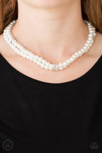 Load image into Gallery viewer, Pinched between white rhinestone encrusted frames, strands of classic white pearls layer around the neck for a timeless look. Features an adjustable clasp closure.  Sold as one individual necklace. Includes one pair of matching earrings.  Always nickel and lead free.