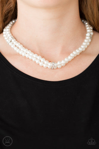 Pinched between white rhinestone encrusted frames, strands of classic white pearls layer around the neck for a timeless look. Features an adjustable clasp closure.  Sold as one individual necklace. Includes one pair of matching earrings.  Always nickel and lead free.
