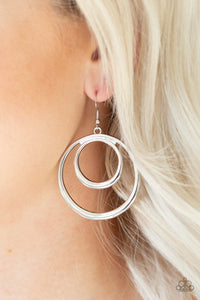 Brushed in a high-sheen finish, glistening silver bars swirl into a dizzying frame for a casual look. Earring attaches to standard fishhook fitting.  Sold as one pair of earrings.  Always nickel and lead free.