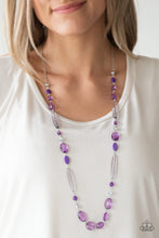 Load image into Gallery viewer, Varying in shape and shimmer, faceted purple and metallic crystal-like beads trickle down the chest for a whimsical look. Features an adjustable clasp closure.  Sold as one individual necklace. Includes one pair of matching earrings. 