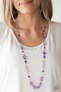 Varying in shape and shimmer, faceted purple and metallic crystal-like beads trickle down the chest for a whimsical look. Features an adjustable clasp closure.  Sold as one individual necklace. Includes one pair of matching earrings. 