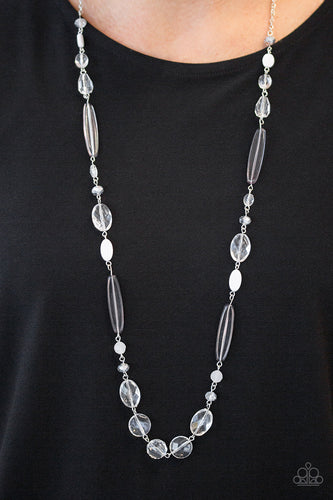Varying in shape and shimmer, faceted white and metallic crystal-like beads trickle down the chest for a whimsical look. Features an adjustable clasp closure.  Sold as one individual necklace. Includes one pair of matching earrings.  