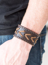 Load image into Gallery viewer, Rustic leather laces weave through a thick leather band for a rugged look. Features an adjustable snap closure.  Sold as one individual bracelet.