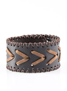 Rustic leather laces weave through a thick leather band for a rugged look. Features an adjustable snap closure.  Sold as one individual bracelet.