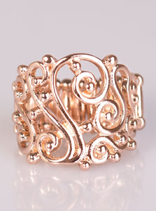 Glistening rose gold bars swirl across the finger, creating airy filigree. Shiny rose gold studs are sprinkled across the frilly pattern, adding tactile shimmer to the regal pattern. Features a stretchy band for a flexible fit.   Sold as one individual ring. 