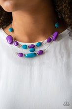 Load image into Gallery viewer, Infused with dainty metallic accents, a collection of faceted blue, purple, and sparkling crystal-like beads are threaded along invisible wires below the collar for a whimsically layered look. Features an adjustable clasp closure.  Sold as one individual necklace. Includes one pair of matching earrings.  Always nickel and lead free.
