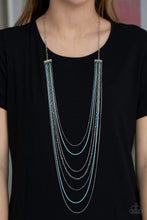 Load image into Gallery viewer,   Mismatched silver chains alternate with dainty blue chains down the chest, creating a colorful industrial look. Features an adjustable clasp closure.  Sold as one individual necklace. Includes one pair of matching earrings.  Always nickel and lead free.
