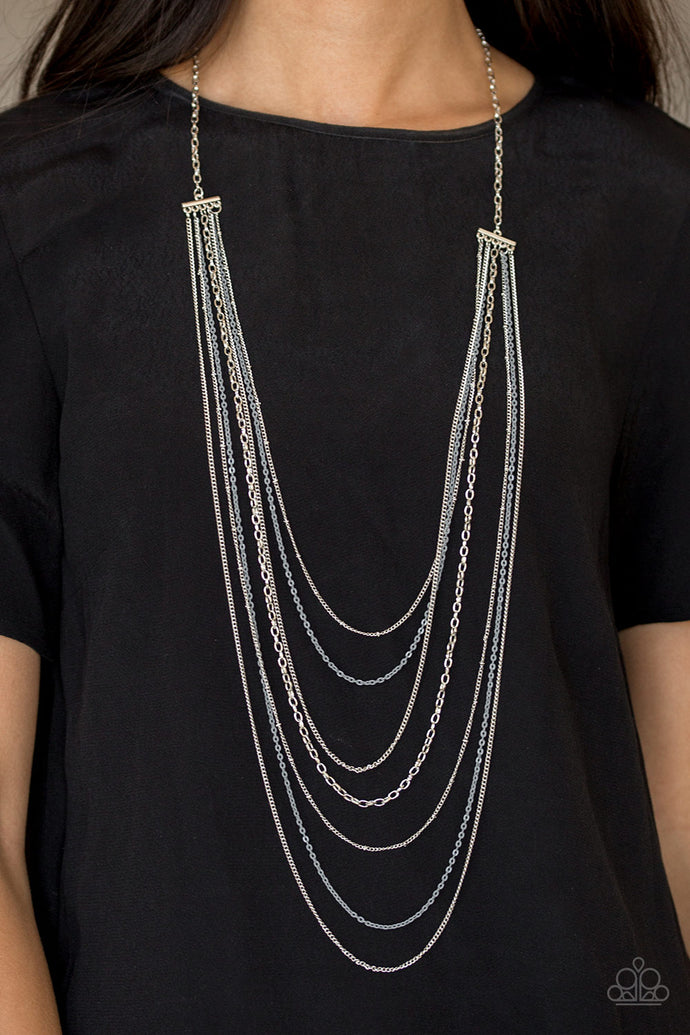 Mismatched silver chains alternate with dainty gray chains down the chest, creating a colorful industrial look. Features an adjustable clasp closure.  Sold as one individual necklace. Includes one pair of matching earrings.  Always nickel and lead free.