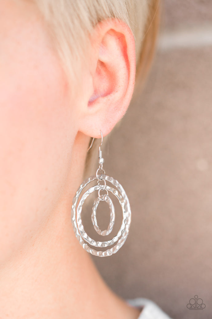 Delicately hammered in rippling shimmer, three silver hoops swing from the ear, joining into a dizzying lure. Earring attaches to a standard fishhook fitting.  Sold as one pair of earrings.  Always nickel and lead free.