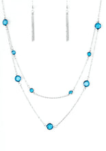 Load image into Gallery viewer, Varying in size, glassy blue gems trickle along dainty silver chains, creating sparkling layers across the chest. Features an adjustable clasp closure.  Sold as one individual necklace. Includes one pair of matching earrings.