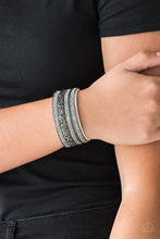 Load image into Gallery viewer, Rows of shimmery gunmetal chains, smoky rhinestones, and metallic prism rhinestones are sprinkled along a thick white suede band for a sassy style. Features an adjustable snap closure.  Sold as one individual bracelet. Always nickel and lead free.