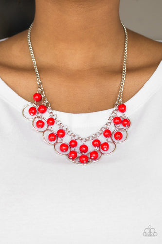 Polished red beads and shimmery silver hoops drip from the bottom of a glistening silver chain, creating a playful fringe below the collar. Features an adjustable clasp closure.  Sold as one individual necklace. Includes one pair of matching earrings.  Always nickel and lead free.