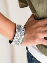 Load image into Gallery viewer,   Featuring classic round and edgy emerald style cuts, glittery white rhinestones and glistening silver chains are encrusted along bands of black suede for a sassy look. Features an adjustable snap closure.  Sold as one individual bracelet.