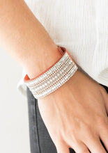 Load image into Gallery viewer, Featuring classic round and edgy emerald style cuts, glittery white rhinestones and glistening silver chains are encrusted along bands of orange suede for a sassy look. Features an adjustable snap closure.  Sold as one individual bracelet. 