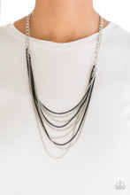 Load image into Gallery viewer, Strands of bold silver links give way to rows of shimmery silver and shiny black chains, creating colorful layers down the chest. Features an adjustable clasp closure.   Sold as one individual necklace. Includes one pair of matching earrings.  Always nickel and lead free. 