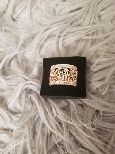 This ring features filigree rose gold frames encased by rows of white rhinestone accents. Features a stretchy band for a flexible fit.  Sold as one individual ring.   Always nickel and lead free.  Fashion Fix Exclusive November 2020