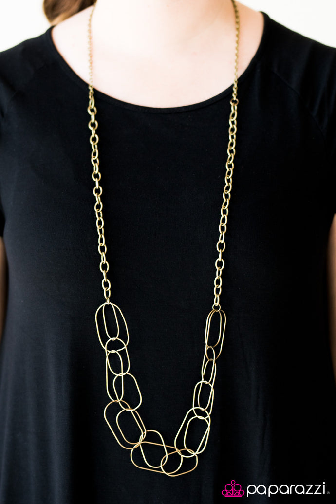 Glistening brass accents join into a web of layered chains. Brushed in a glistening finish, classic brass chains gives way to sections of bolder links as it drapes across the chest for a retro finish. Features an adjustable clasp closure.  Sold as one individual necklace. Includes one pair of matching earrings.