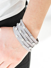 Load image into Gallery viewer, Dotted with glassy white rhinestones, a thick gray leather band has been spliced into five glittery strands around the wrist for a sassy look. Features an adjustable snap closure.  Sold as one individual bracelet.