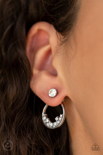 A solitaire white rhinestone attaches to a double-sided post, designed to fasten behind the ear. Encrusted in dainty white rhinestones, the circular double-sided post peeks out beneath the ear for a bold look. Earring attaches to a standard post fitting.  Sold as one pair of double-sided post earrings.   Always nickel and lead free.