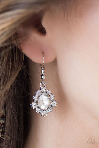 Dainty white rhinestones dance around a shimmery white teardrop, creating a regal frame. Earring attaches to a standard fishhook fitting.  Sold as one pair of earrings.  Always nickel and lead free.