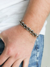 Load image into Gallery viewer, Shiny brown cording weaves through hammered silver beads around the wrist for an urban look. Features an adjustable sliding knot closure.  Sold as one individual bracelet.
