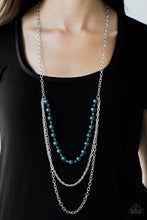 Load image into Gallery viewer, A strand of blue pearls give way to shimmery silver chains, creating refined layers down the chest for a glamorous look. Features an adjustable clasp closure.  Sold as one individual necklace. Includes one pair of matching earrings.  Always nickel and lead free.