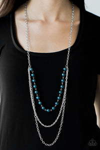 A strand of blue pearls give way to shimmery silver chains, creating refined layers down the chest for a glamorous look. Features an adjustable clasp closure.  Sold as one individual necklace. Includes one pair of matching earrings.  Always nickel and lead free.