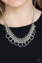 Load image into Gallery viewer, Rows of shiny silver beads and hammered rings swing from the bottom of interlocking silver chains, creating a bold fringe below the collar. Features an adjustable clasp closure.  Sold as one individual necklace. Includes one pair of matching earrings.  Always nickel and lead free.