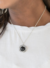 Load image into Gallery viewer, Glistening silver bars swirl around a shiny black bead, creating a colorful pendant below the collar for a seasonal look. Features an adjustable clasp closure.  Sold as one individual necklace. Includes one pair of matching earrings.