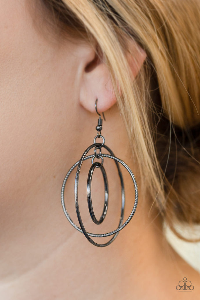 Smooth and serrated gunmetal hoops trickle from the ear, linking into a dizzying lure. Earring attaches to a standard fishhook fitting.  Sold as one pair of earrings.  Always nickel and lead free.