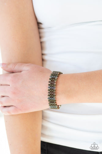  Dainty silver beads and stacked brass, copper, and silver frames radiating with sunburst patterns are threaded along stretchy bands around the wrist for a whimsical look.  Sold as one individual bracelet.  Always nickel and lead free.
