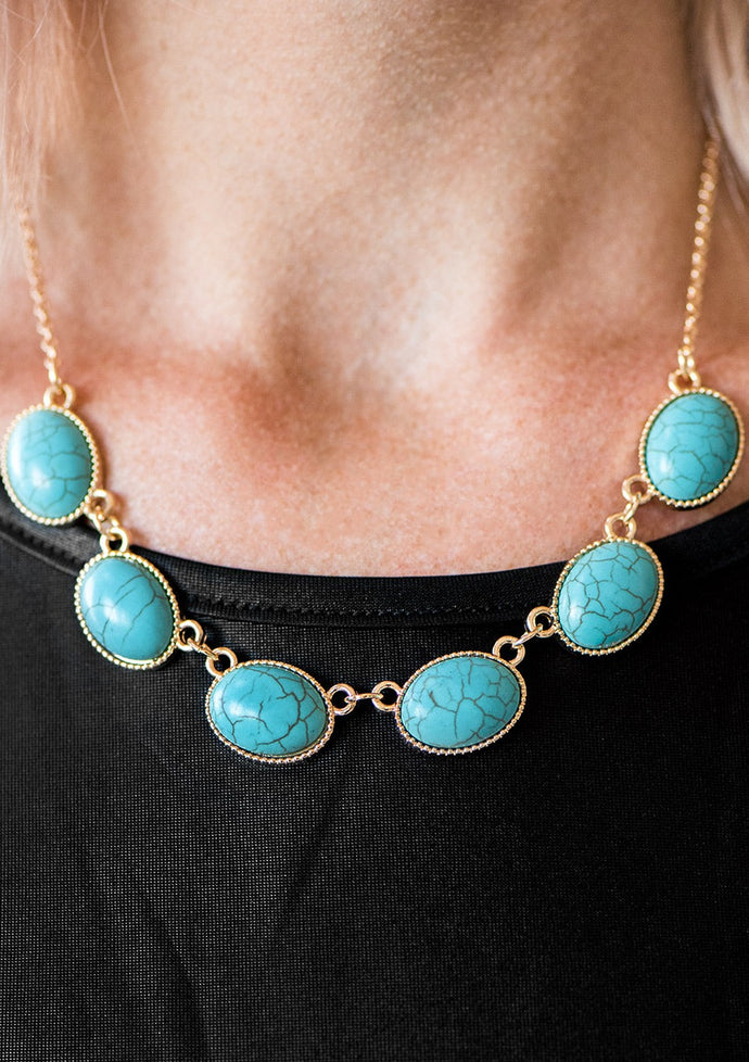 Smooth turquoise stones are pressed into shimmery gold frames, creating a natural and earthy look below the collar. Features an adjustable clasp closure.  Sold as one individual necklace. Includes one pair of matching earrings.  