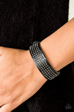 Load image into Gallery viewer, Dainty metallic beads are pressed across the front of a black leather band for a rugged look. Features an adjustable snap closure.  Sold as one individual bracelet.  Always nickel and lead free.