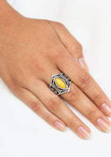 Load image into Gallery viewer, Featuring a marquise shape, a hearty yellow bead is pressed into a shimmery silver band radiating with vine-like filigree for a whimsical look. Features a stretchy band for a flexible fit.  Sold as one individual ring.  