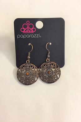 A copper rhinestone glistens in a copper frame radiating with a whimsical floral pattern. Earring attaches to a standard fishhook fitting.  Sold as one pair of earrings.  Always nickel and lead free. 